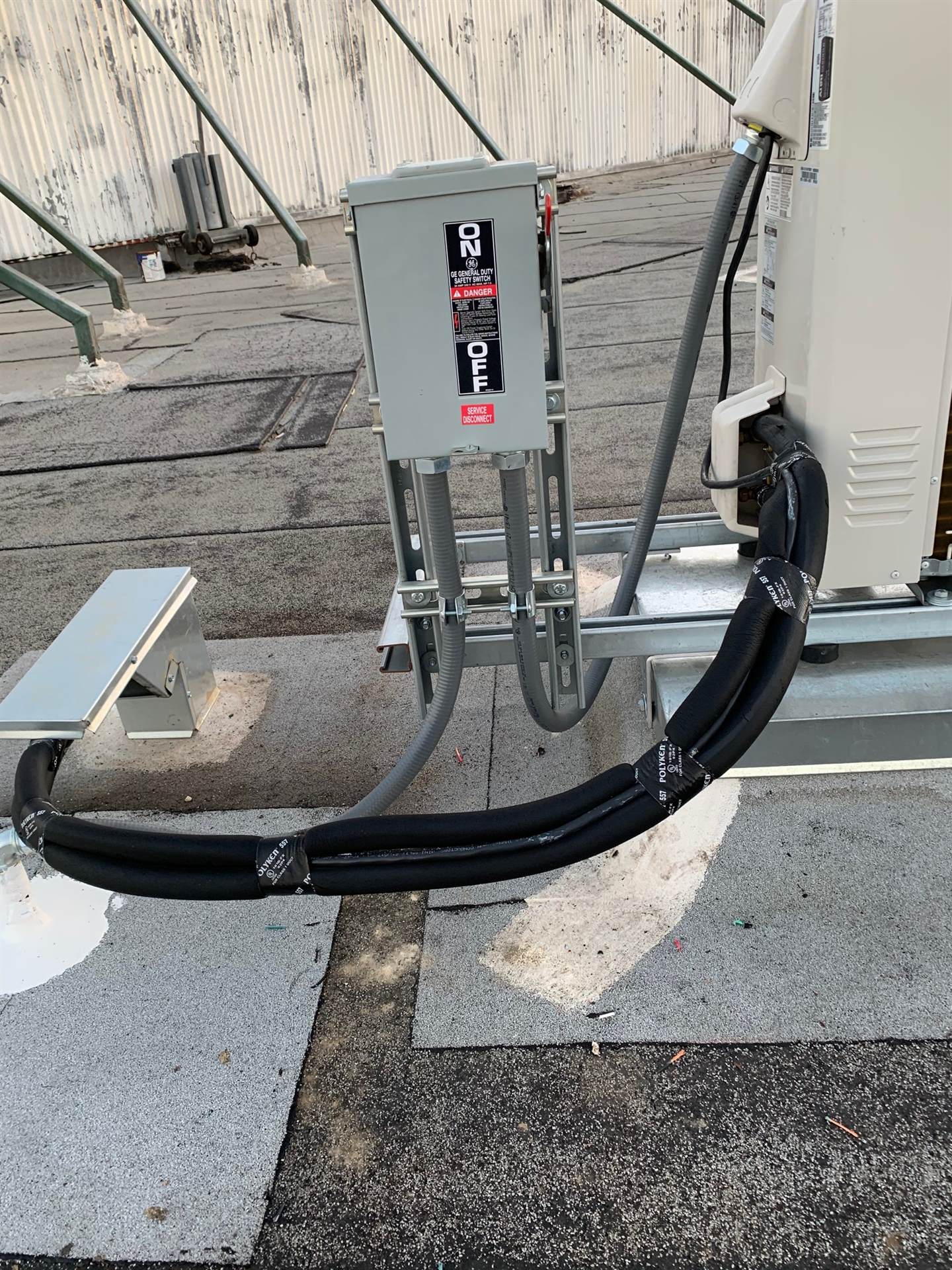 Rooftop electrical service disconnect and equipment connection